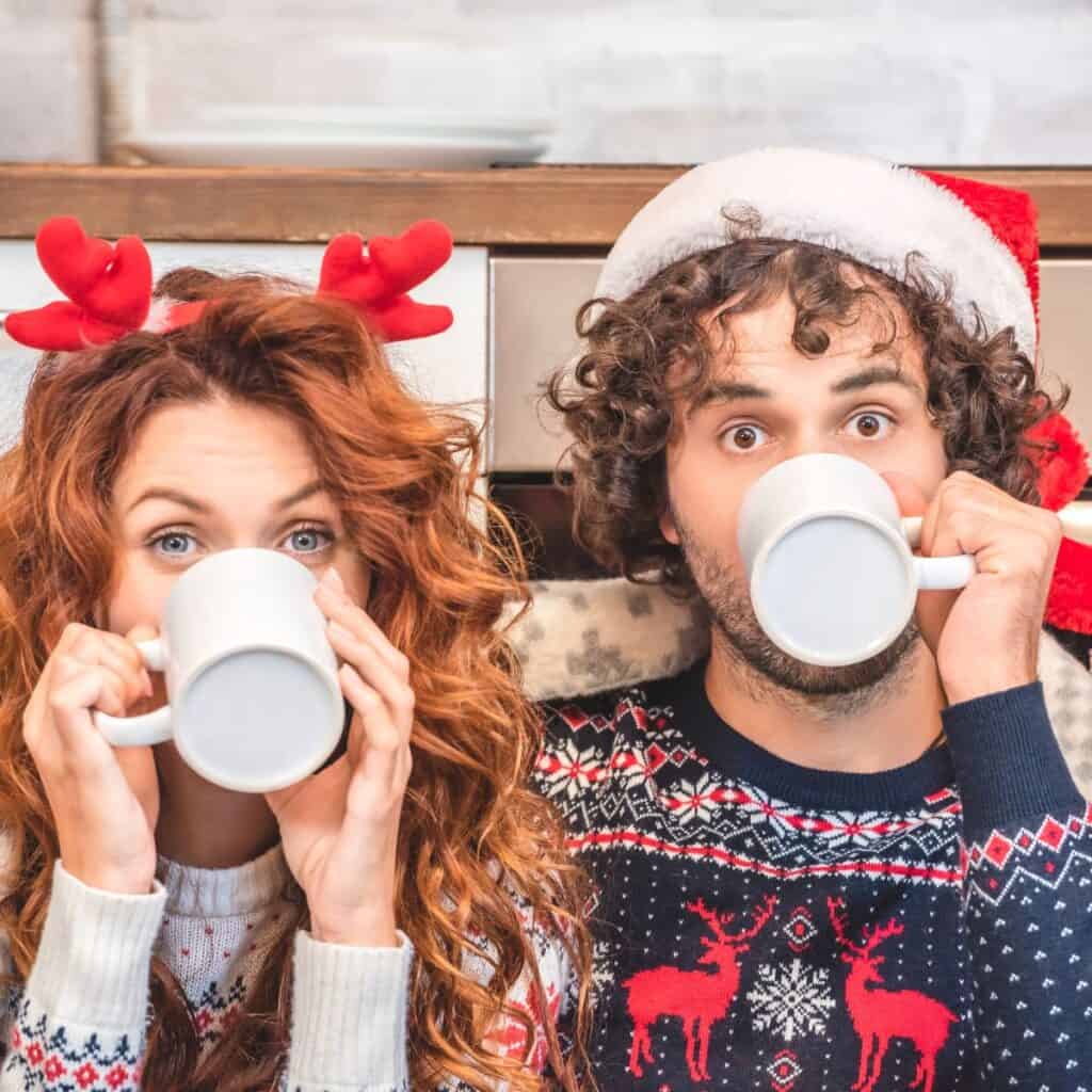 A couple drinking a cup of coffee together thinking on how to survive your family Christmas