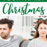 A couple looking stressed with Christmas decorations behind them.