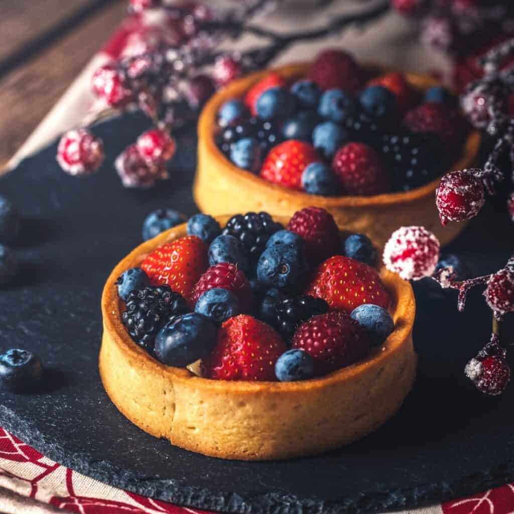 Blueberries, raspberries, and strawberries prepared on the table as part of winter date ideas at home