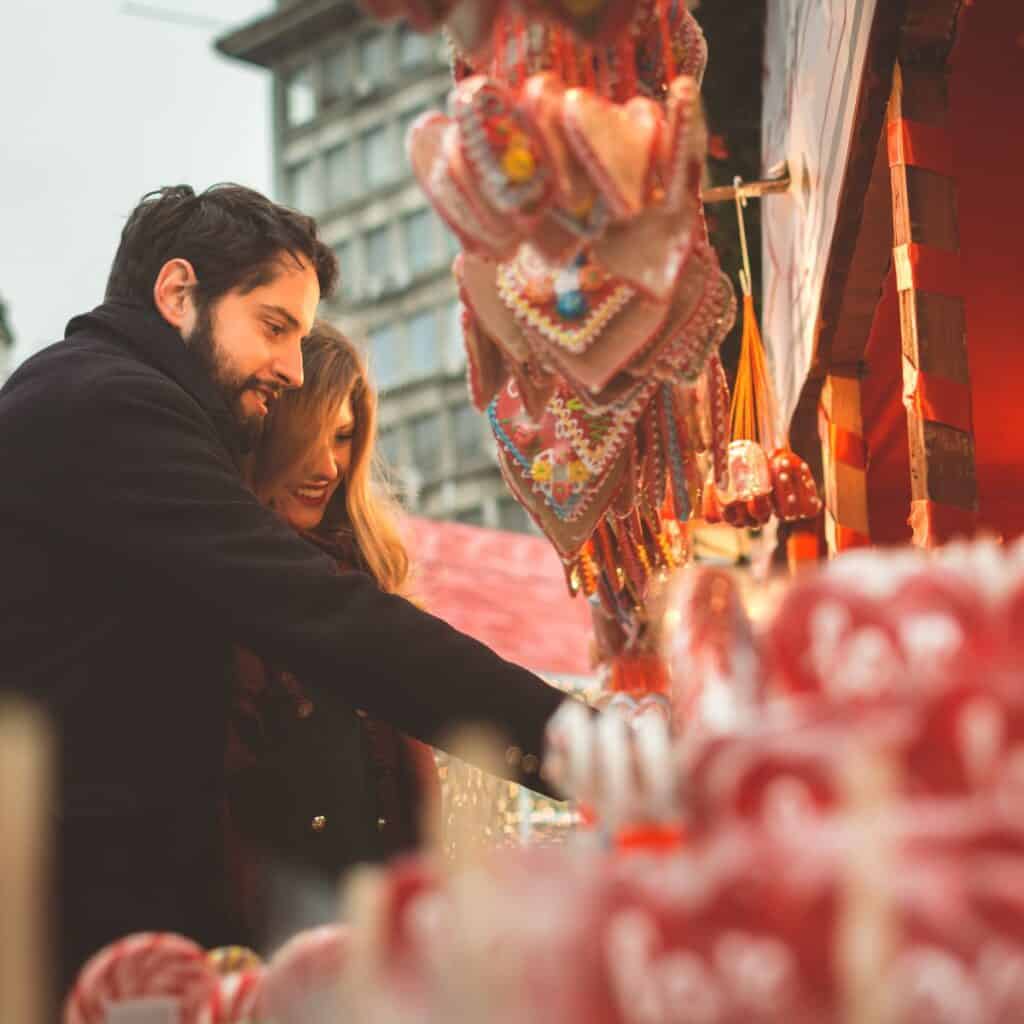 A couple shopping together on a market, a perfect Christmas winter date 