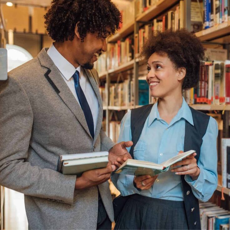 A couple having fun at the library together after reading ideas on date night at the library