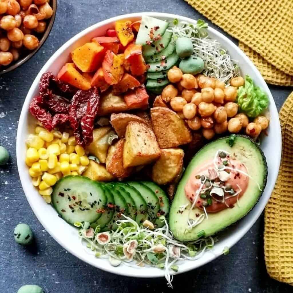 A bowl of green salad cooked on a mother son date night.