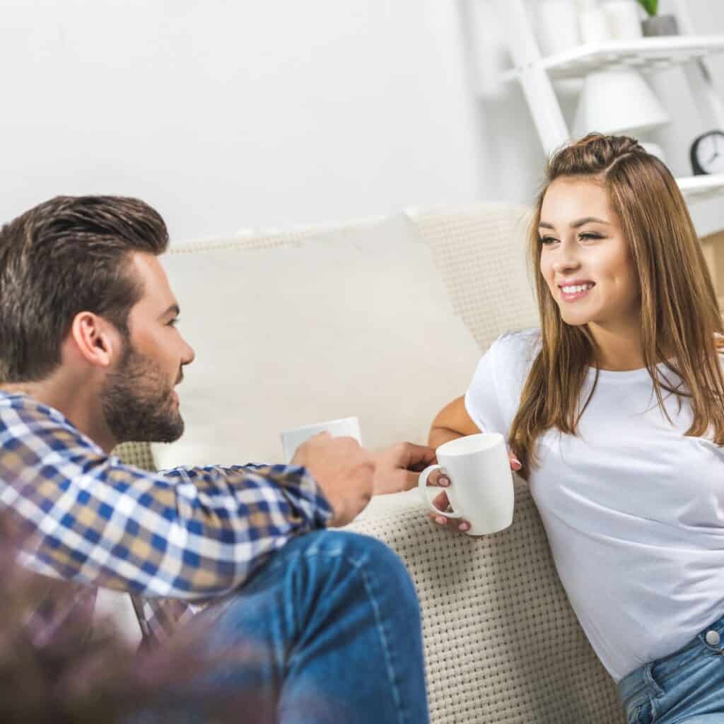 A couple at home having coffee playing would you rather