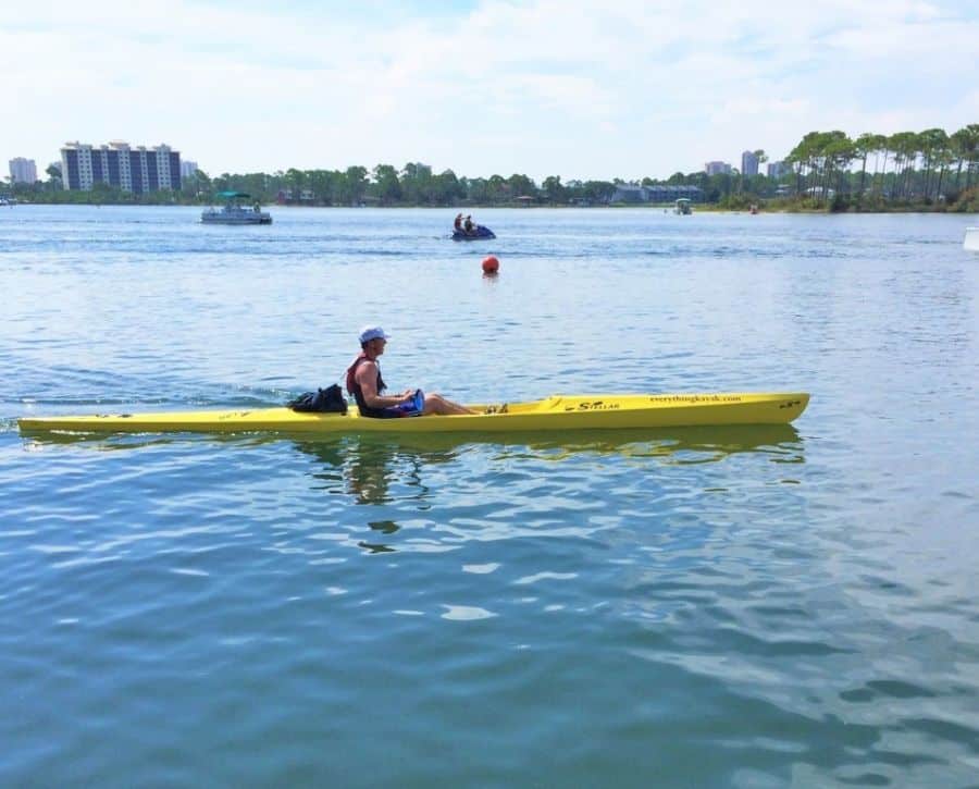 Cheap weekend getaways: A man on a yellow kayak in Perdido Key Florida.