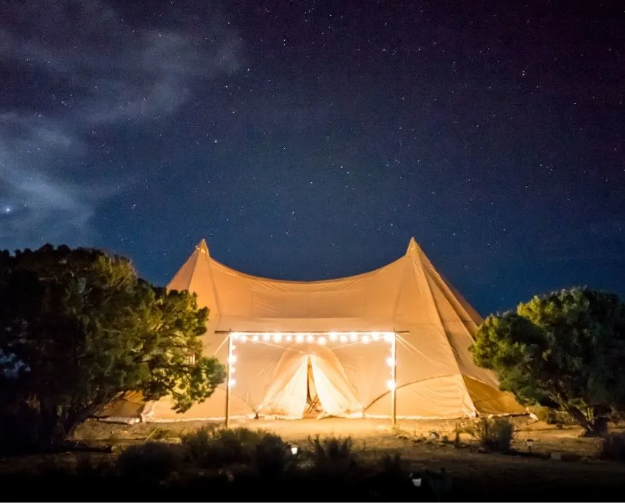 Glamping at night: one of the cheap weekend getaway ideas for couples featured in this article.