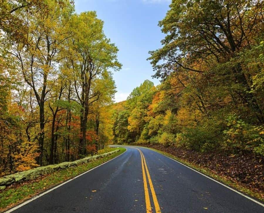 Driving down road into Shenadoah National Park: enjoying one of these cheap getaways for couples.