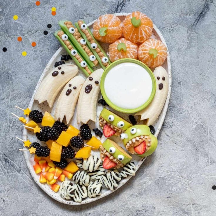 Assorted Halloween food prepared in a tray after reading these Halloween treats to die for