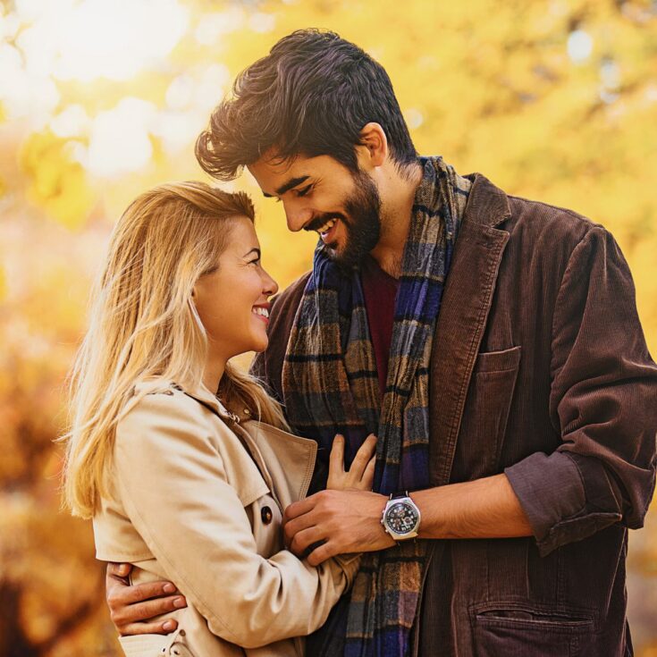 A couple being intimate while enjoying fall together after reading these fall date ideas