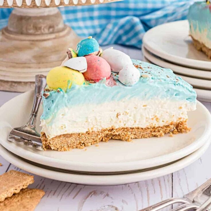 Easter egg cheesecake topped with colorful little eggs