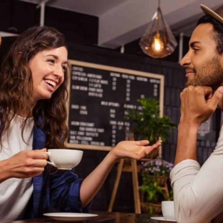 A couple having a coffee while asking how well do you know me questions