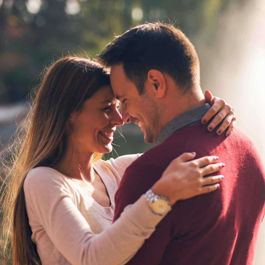 A beautiful romantic couple hugging each other after reading these romantic date night ideas