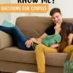 A couple on the couch being intimate, the boy sitting, the girl laying on the boy's chest with the text overlay how well do you know me? questions for couples