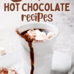 A cup of hot chocolate with marshmallows on top with the text overlay 25 delicious hot chocolate recipes