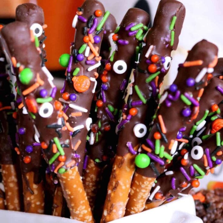 Chocolate-covered pretzel snack designed with sprinkles, prepared after reading these Halloween snacks date ideas