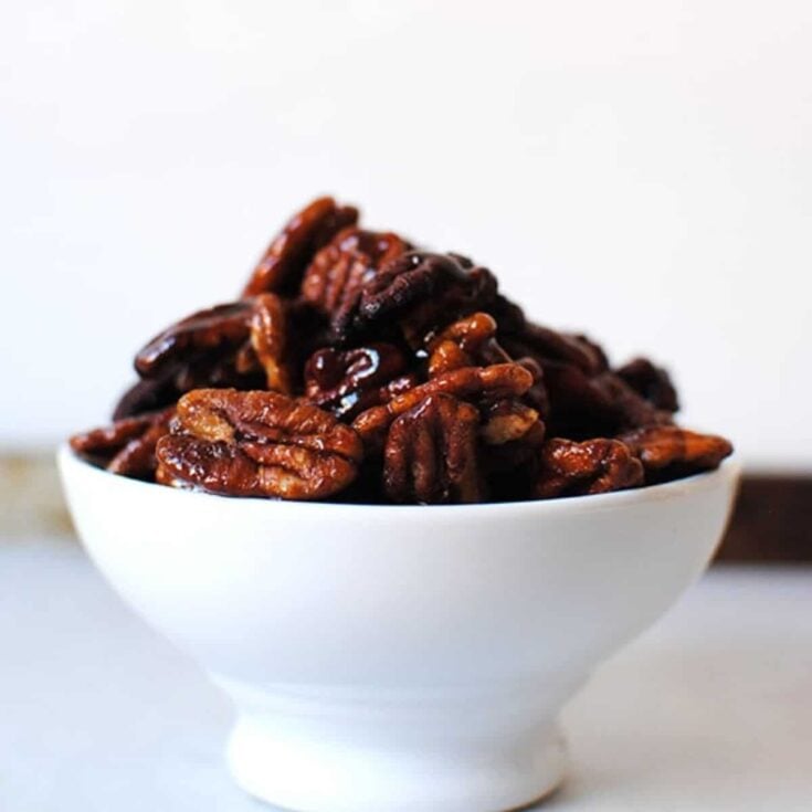 A bowl of Maple bourbon candied pecans perfect as Super bowl appetizer