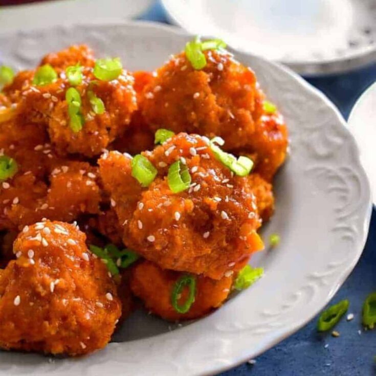 A plate of sticky spicy cauliflower wings perfect as Super bowl appetizier
