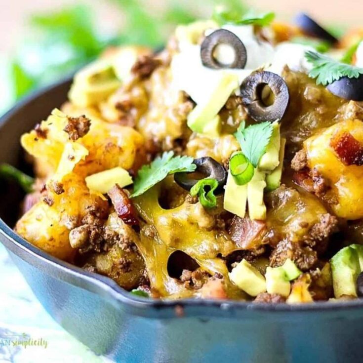 A bowl of loaded tater tot nachos perfect as Super bowl appetizer