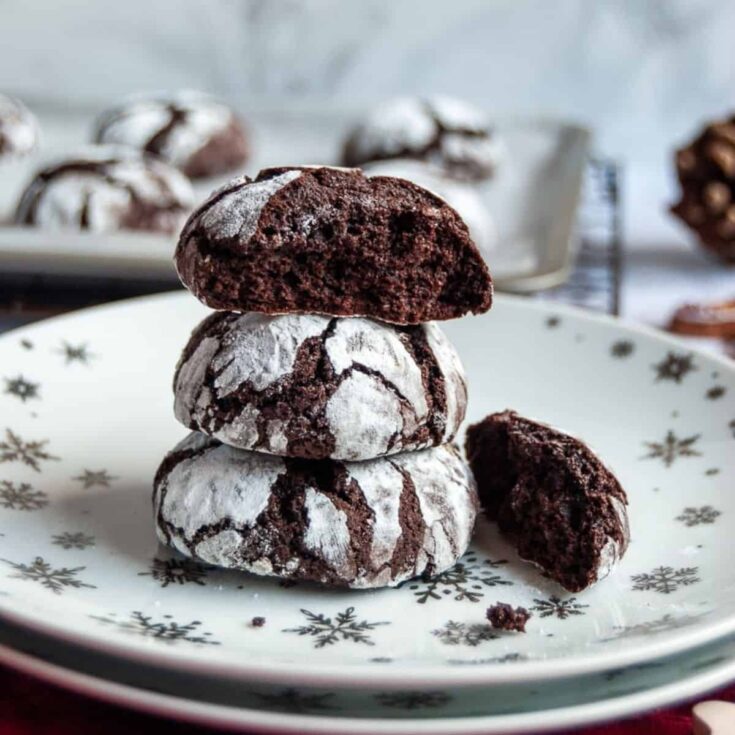 A stack of delicious chocolate fudge crinkle cookies perfect to serve as Christmas cookies