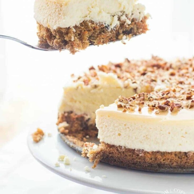 A delicious carrot cheesecake with a sliced portion