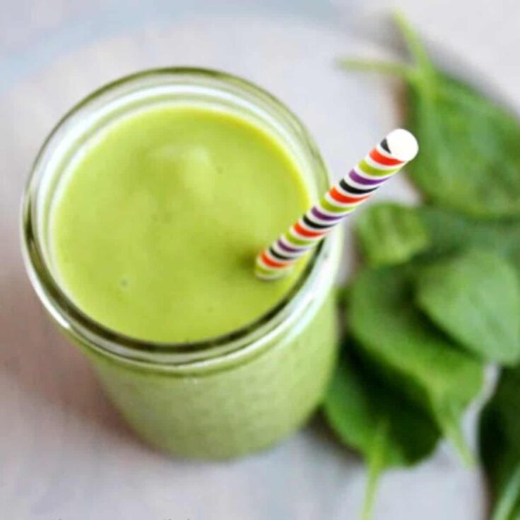 A green smoothie served on the table