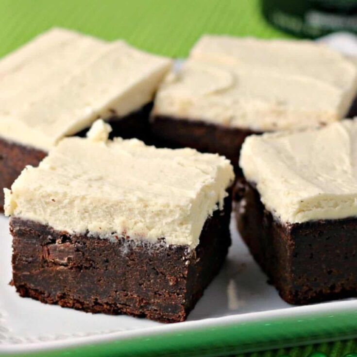 A set of Guinness brownies with maple buttercream frosting served on a plate