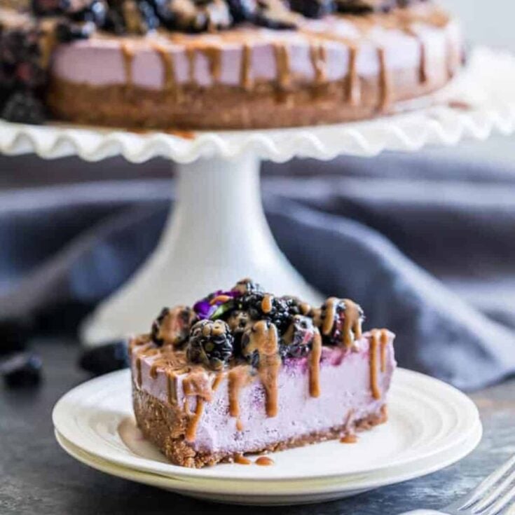 A slice of no bake caramel blackberry cheesecake