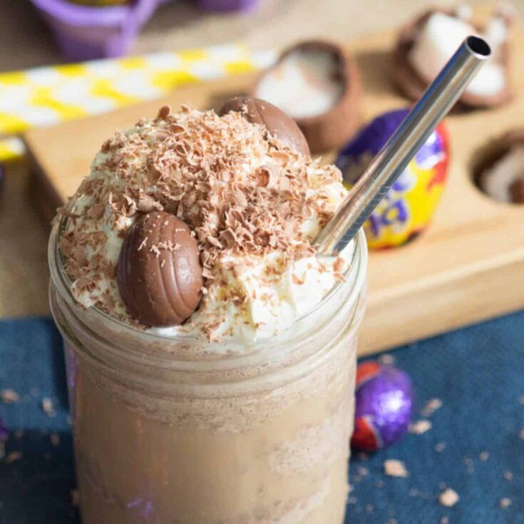 A glass of Cadbury creme egg frappuccino served on the table