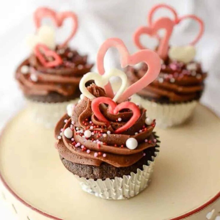 A set of beautifully made chocolate hearts toppers Valentines Day cupcakes