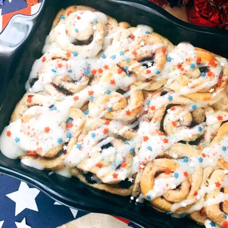 A tray of patriotic sweet berry rolls perfect for 4th of July breakfast ideas