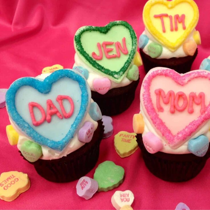 A set of personalized conversation heart Valentines Day cupcakes