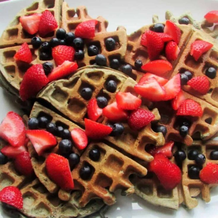 A set of appetizing red, white, and blueberry sourdough waffles perfect as one of 4th of July breakfast ideas