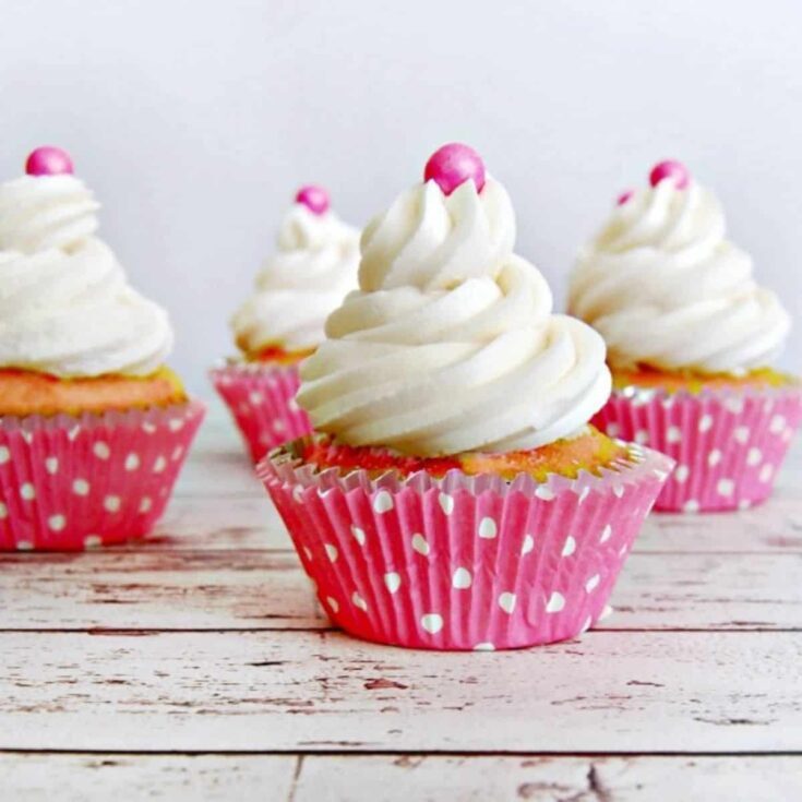 A set of strawberry cream Valentines Day cupcakes