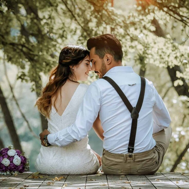 A back view of a married couple facing each other after reading these Christian marriage quotes from the Bible