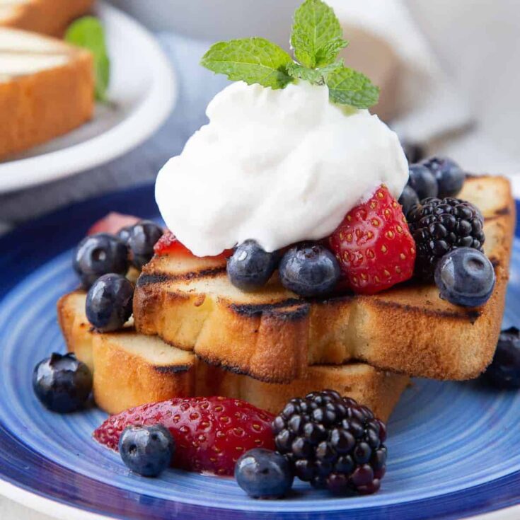 A plate of appetizing Grilled pound cake with berries and cream Patriotic Cake