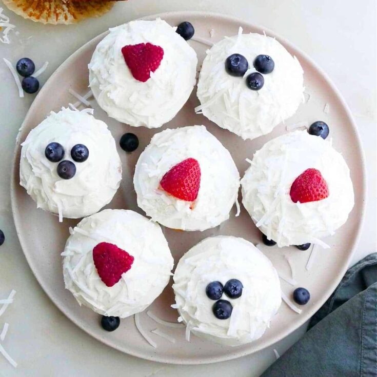 A tray of mixed berry with coconut buttercream Patriotic Cupcakes