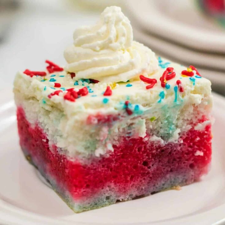 A slice of delicious red, white and blue patriotic poke cake