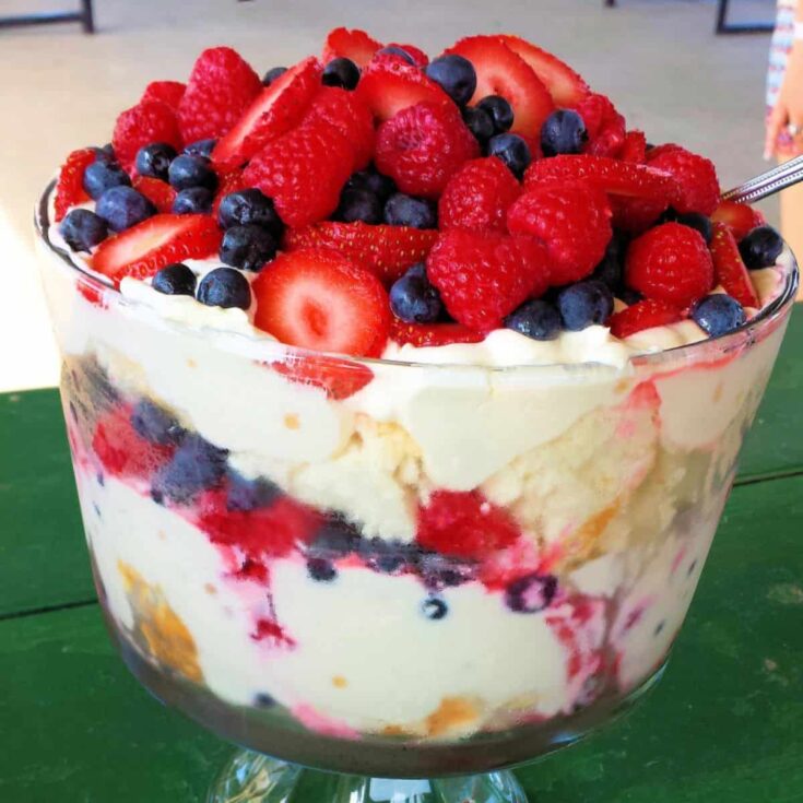 A bowl of delicious triple berry angel: red white and blue trifle