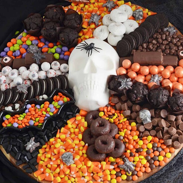 Halloween charcuterie boards with edible skull in the middle