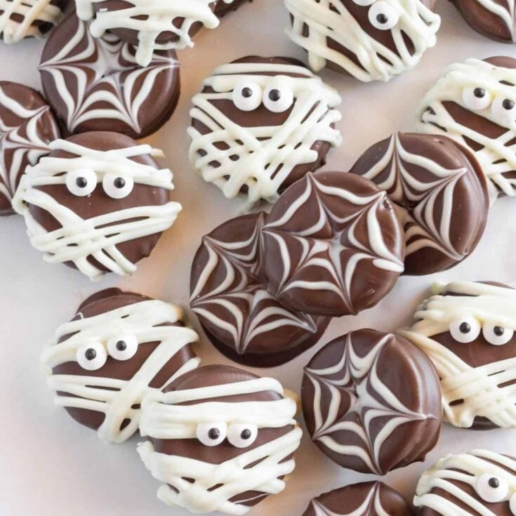 Scattered Halloween chocolate covered Oreo cookies