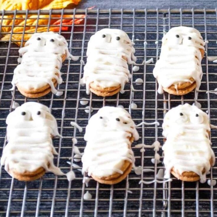 A tray of Halloween Mummy cookies filled with white icing