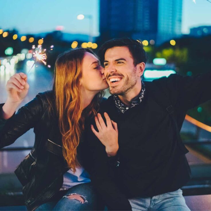 A happy couple having fun around the city after reading these weeknight date ideas