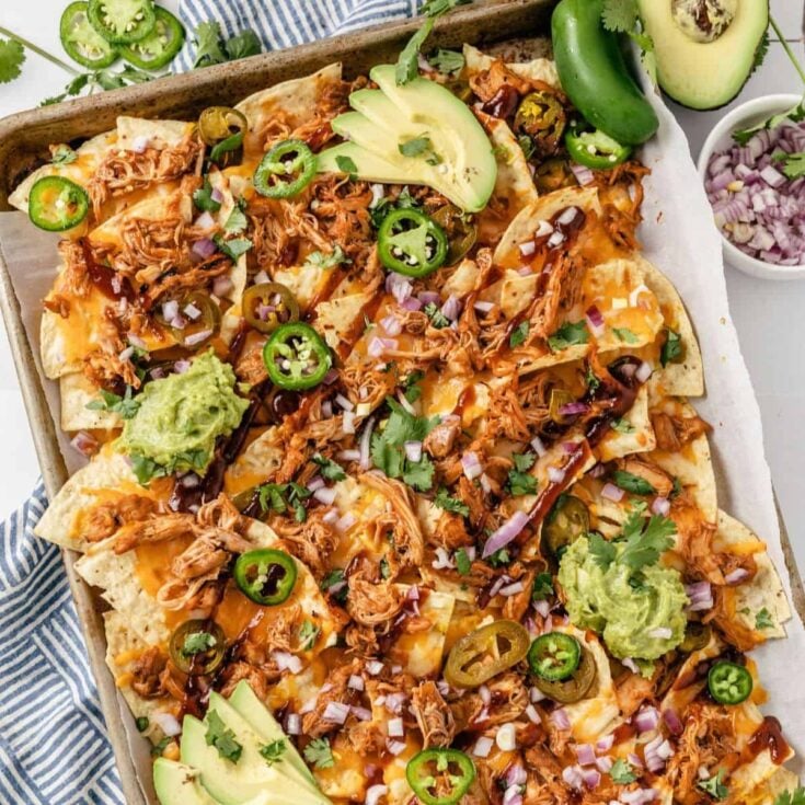 A tray of BBQ chicken nachos cooked after reading these Tailgating recipes