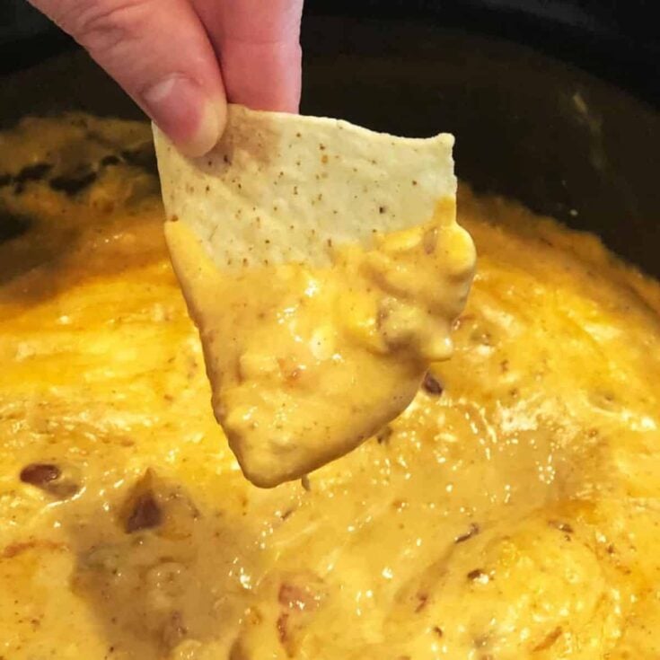 A bowl of crockpot chili cheese dip cooked after reading these Tailgating recipes