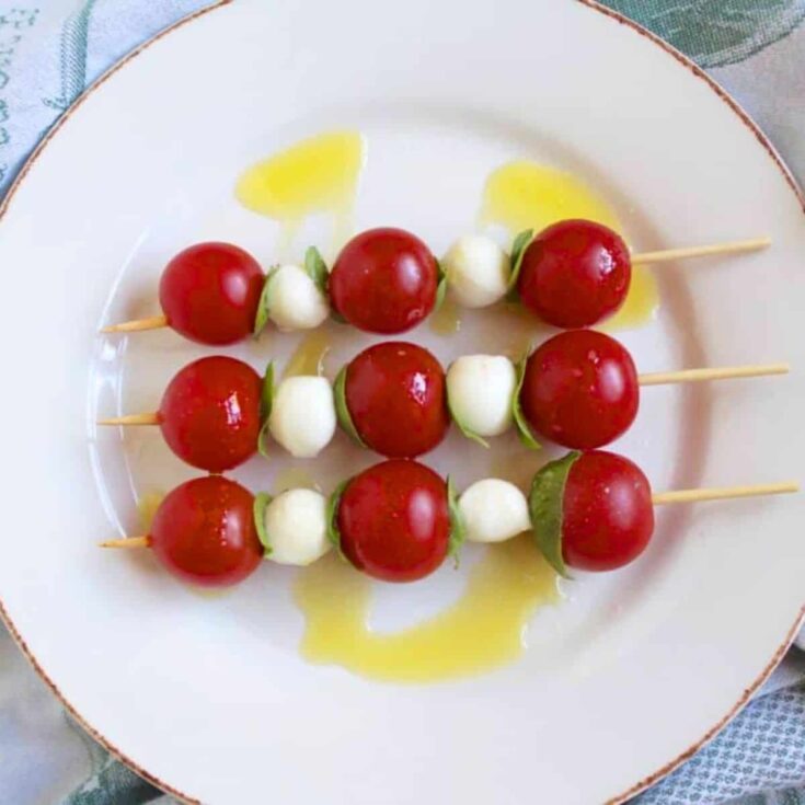 A plate of Caprese skewers prepared after reading these summer appetizers recipe