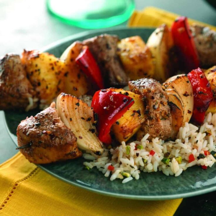 A plate of Caribbean pork kabobs cooked after reading these Summer grilling recipes