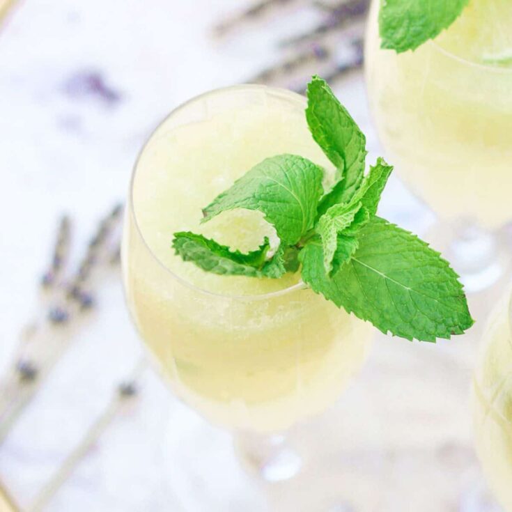 A glass of cucumber lime lavender spritzer Summer mocktail