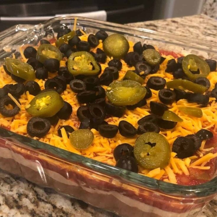 A five layer Mexican dip with salsa, cooked after reading these Tailgating recipes