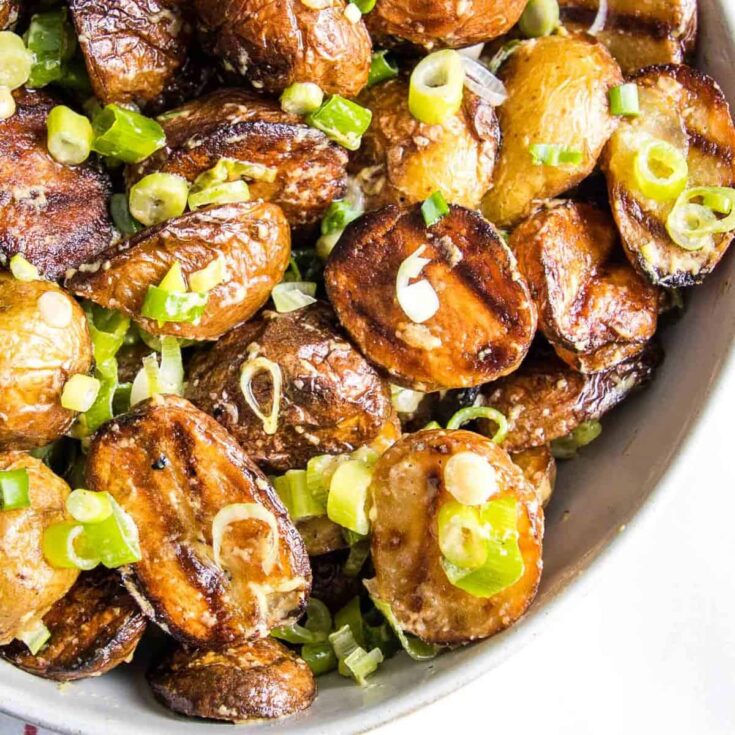 A bowl of grilled potato salad cooked after reading these Summer grilling recipe