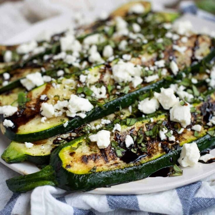 A plate of grilled zucchini cooked after reading these Summer grilling recipes