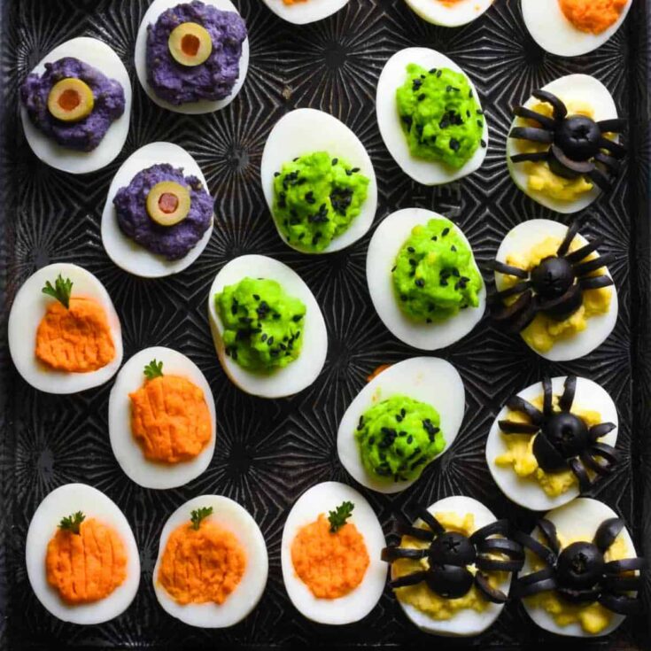 A set of colorful Halloween deviled eggs cooked after reading these Halloween starters